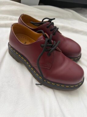 Dr. Martens oxblood leather 3-eye derby with yellow welt stitching